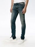 distressed effect skinny jeans