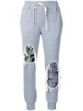 distressed track pants