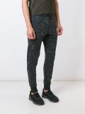camouflage print tapered trousers