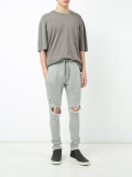 distressed track pants