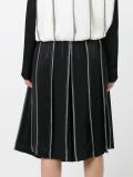 exposed seam pleated skirt