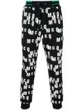 all-over logo print track pants