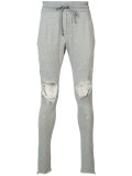 distressed track pants