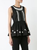 ruffled sleeveless blouse