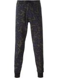 camouflage print tapered trousers