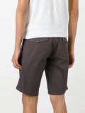 shorts with button closure flap pockets
