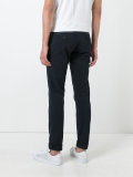 chinos with buttoned rear pockets