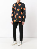 orange print shirt