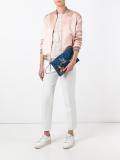 embroidered bird denim clutch