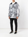 marble-effect hooded windbreaker