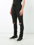 distressed track pants