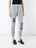 distressed track pants