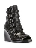 buckled straps boots