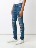 distressed slim jeans