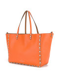 reversible studded shoulder bag