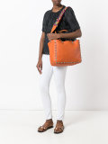 reversible studded shoulder bag