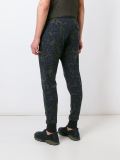 camouflage print tapered trousers