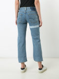 patch and frayed jeans