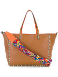 reversible studded shoulder bag