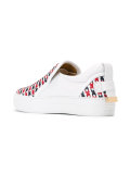 crossed slip-on trainers
