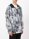 marble-effect hooded windbreaker
