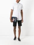 designer's patch zip clutch
