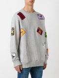 multi patched sweatshirt 