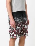 camouflage print track shorts