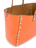 reversible studded shoulder bag