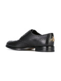 studded tiger's head brogues