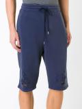 distressed track shorts