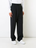 wide-legged pleated trousers