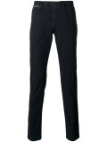 chinos with buttoned rear pockets