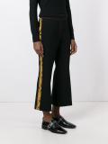 python skin effect cropped trousers