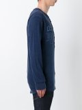 floral logo henley