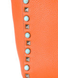 reversible studded shoulder bag