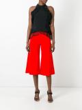 ruffled sleeveless blouse