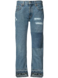 patch and frayed jeans
