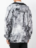 marble-effect hooded windbreaker