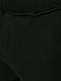 raw edge track pants