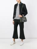 flap closure shoulder bag