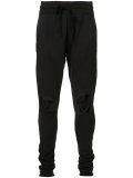 distressed track pants