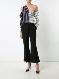 long-sleeve button-down top with open shoulders