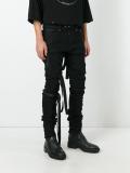 elongated strappy skinny jeans