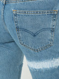 patch and frayed jeans