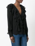 deep V-neck ruffled blouse
