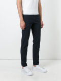 chinos with buttoned rear pockets