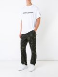 camouflage print trousers