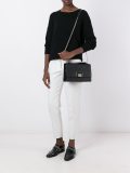flap closure cross body bag