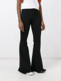 frayed flared trousers 